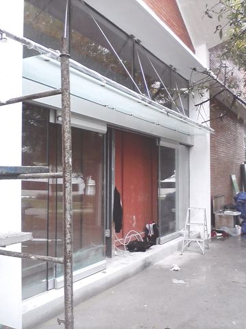ITESM F. Arq. Puerta automatica con sistema Antipanico Puertas batientes y Marquesina